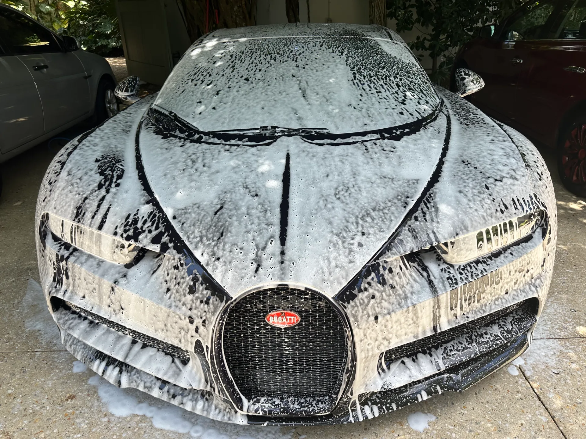 Bugatti Chiron covered in foam during a brush-free hand wash by Lavish Touch in West Palm Beach
