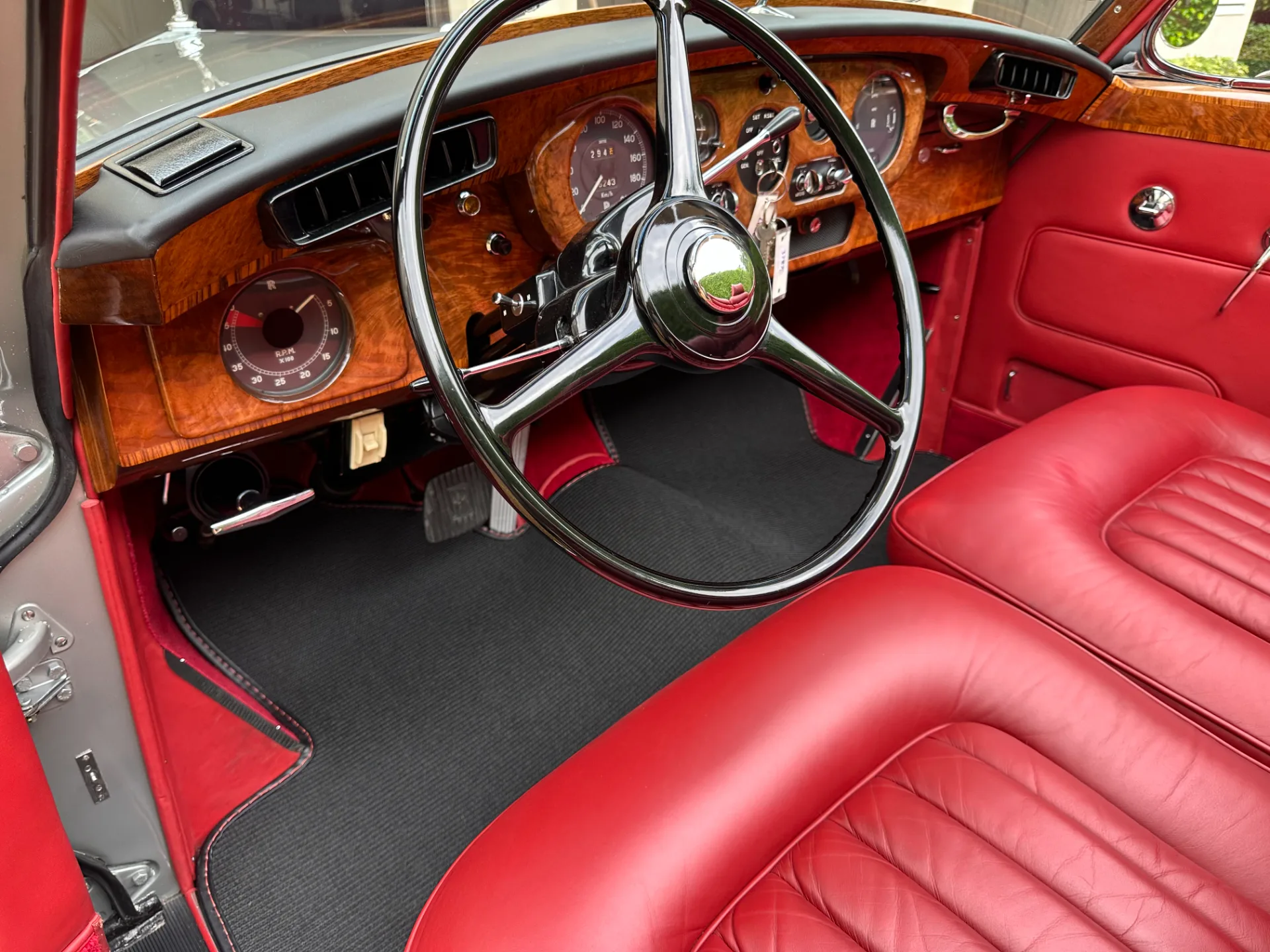 Wood dashboard and gauges of a Rolls-Royce Silver Cloud III after interior detailing