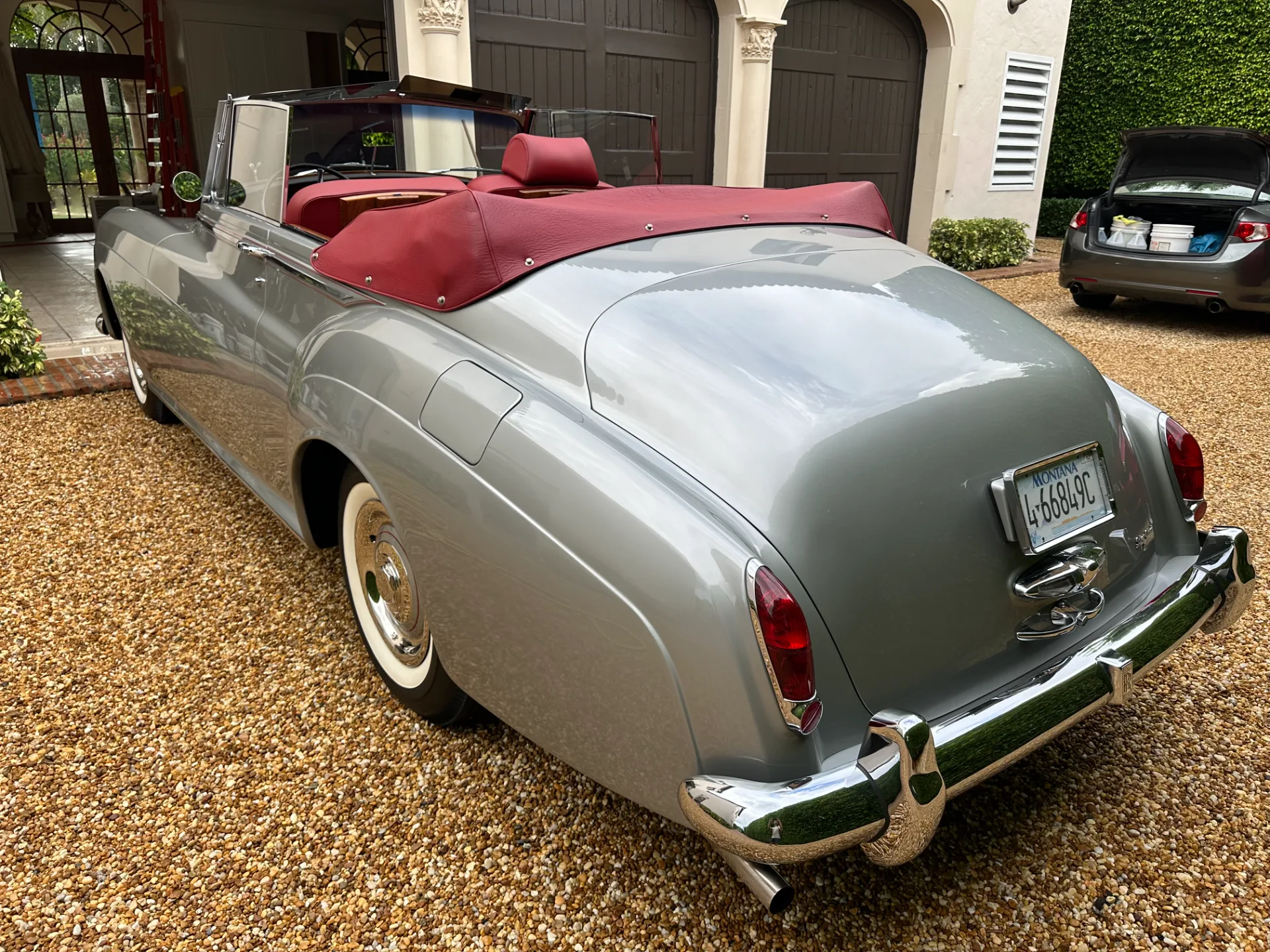 Rear of a Rolls-Royce Silver Cloud III drophead with red leather interior, detailed in Palm Beach